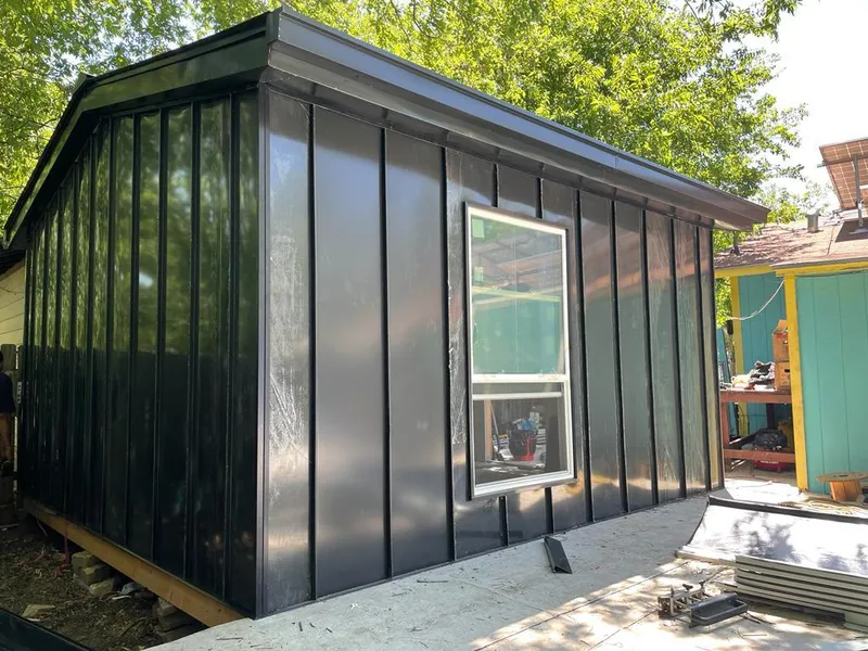 Black standing seam metal wall panels for Metal Roof Installation in Lakes of the Four Seasons