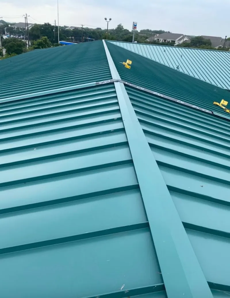 Green commercial metal roof ridge and valley for Metal Roof Repair in Lakes of the Four Seasons